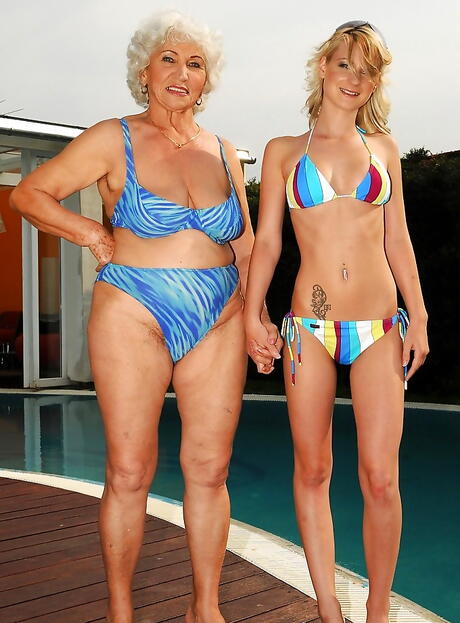 Svelte women Norma and Candy Lover have a passionate lesbian foreplay near the pool