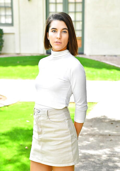 Svelte brunette teen Miki in sexy lingery exposes her butt and puts a toy in her twat outdoor